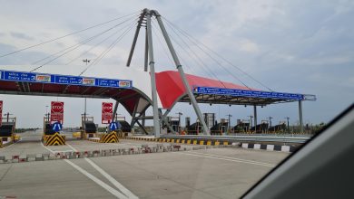 A highway with signage indicating facilities such as petrol pumps and washrooms for commuters' convenience. | Bombay High Court intervention