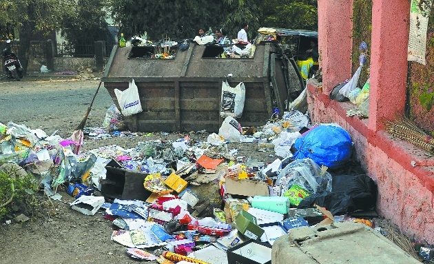 Nagpur skyline with clean streets and waste management symbols. | Nagpur Municipal Corporation | debris dumping.