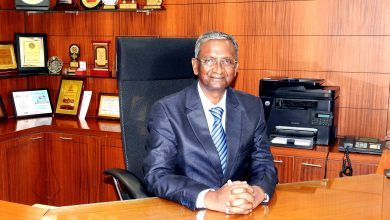 Prof Prem Lal Patel, the new director of VNIT, posing with a backdrop of academic achievements and research contributions.