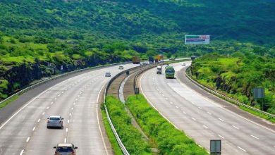 Aerial view of the Nagpur-Mumbai Samruddhi Expressway under construction, highlighting its modern infrastructure and scenic surroundings.