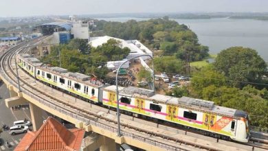 A stalled metro train with passengers walking on tracks near Shankar Nagar station.