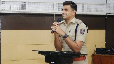 DCP Chandak: A police officer inspecting a seized bike after a rider made a reel while driving in Nagpur's traffic crackdown. Nagpur traffic rules