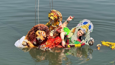 Durga idol immersion at Koradi artificial tank promoting eco-friendly practices.