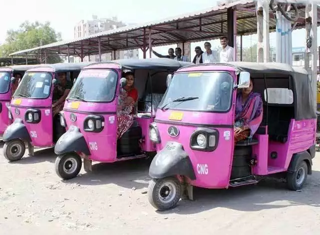 Women driving pink e-rickshaw in Nagpur as part of empowerment initiative.