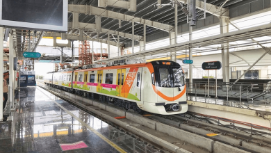 A busy Nagpur Metro station with passengers during festive celebrations.