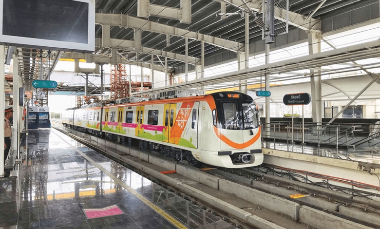 A busy Nagpur Metro station with passengers during festive celebrations.