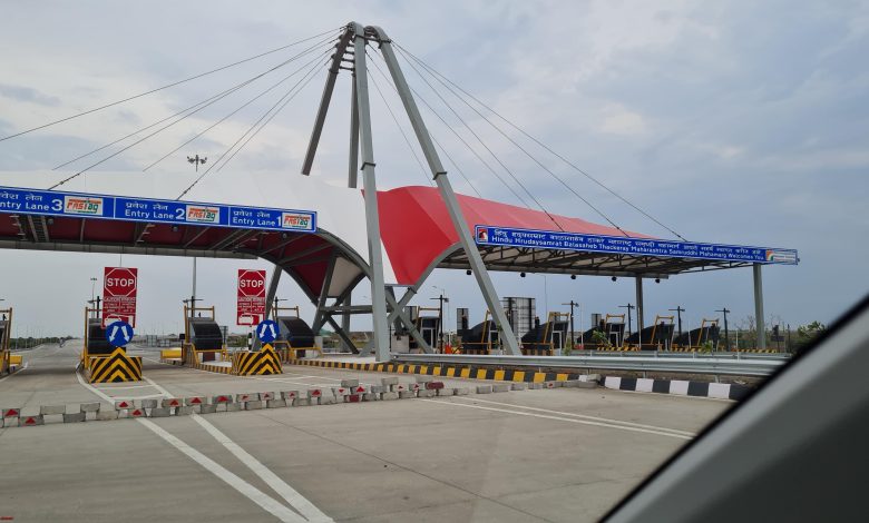 A highway with signage indicating facilities such as petrol pumps and washrooms for commuters' convenience. | Bombay High Court intervention