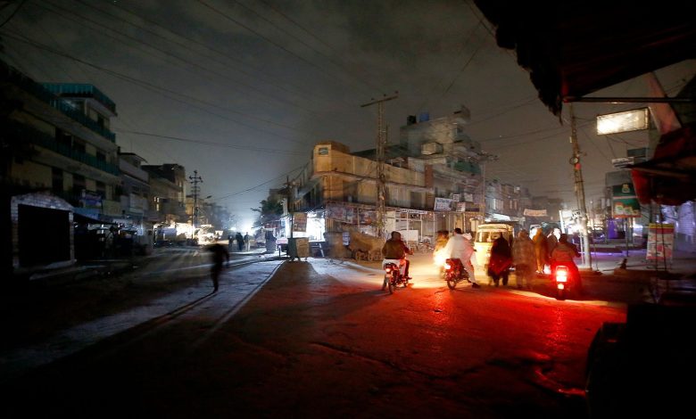 Image of a cityscape during a heavy downpour, with dark clouds and lightning in the background, symbolizing the challenges faced during power outages in Nagpur.