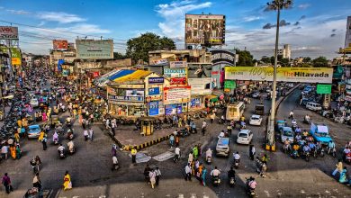 Nagpur: A bustling cityscape with a modern multi-storey parking plaza in the foreground, symbolizing Nagpur's smart parking solutions. | NSSCDCL