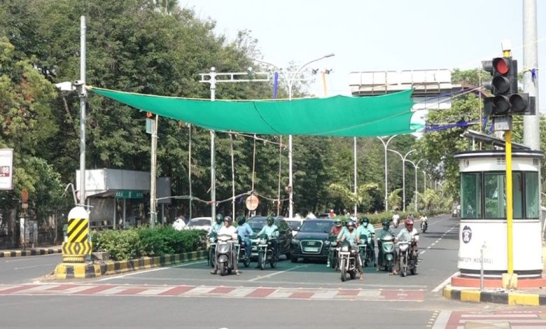 Green nets providing shade at a traffic signal in Nagpur, offering relief to motorists from the intense summer heat.