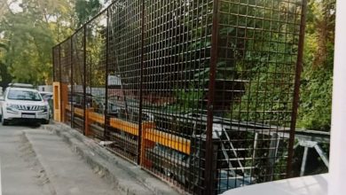 Iron mesh installation on Nagpur bridge to prevent garbage dumping