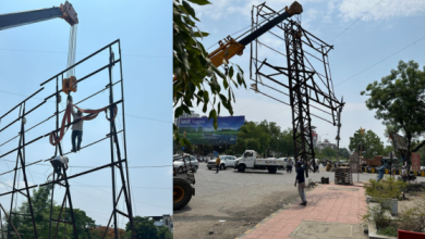 NMC officials inspecting a hoarding in Nagpur | illegal hoardings | railway properties.