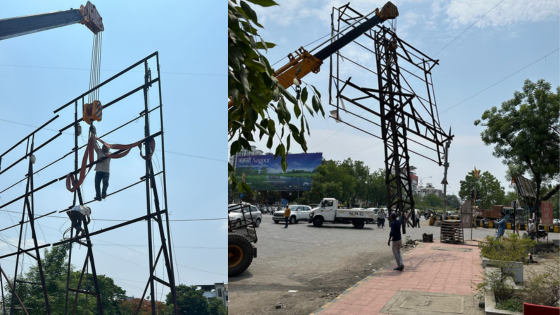 NMC officials inspecting a hoarding in Nagpur | illegal hoardings | railway properties.