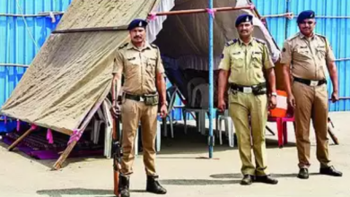 Security personnel guarding EVMs in a fortified area, symbolizing the secure handling of votes during the Nagpur election. Kalamna Market