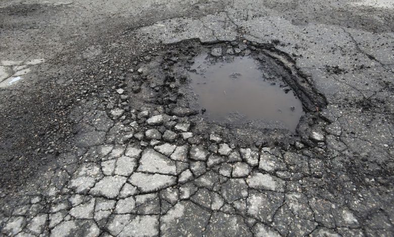 A dangerous pothole on Kalamna Road, Nagpur, posing a threat to motorists.