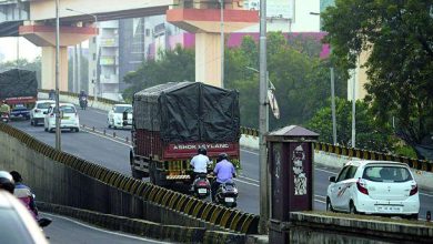 Image showing the installation of height bars on Shahid Gowari flyover to restrict heavy vehicles.