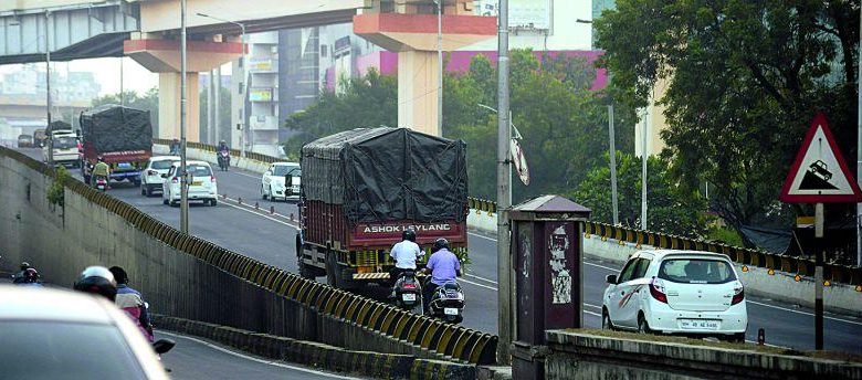 Image showing the installation of height bars on Shahid Gowari flyover to restrict heavy vehicles.