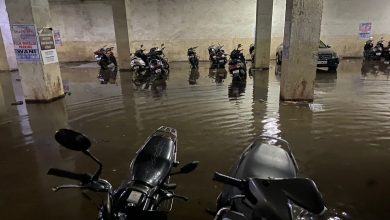 NMC team draining water from a flooded basement in Nagpur.