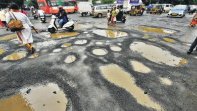 Traffic police managing waterlogged streets in Nagpur during monsoon.