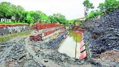 Ambazari Bridge construction site with delayed completion sign