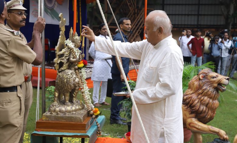 RSS Chief Mohan Bhagwat hoisting the national flag at the RSS Headquarters on Independence Day, symbolizing unity and national pride.