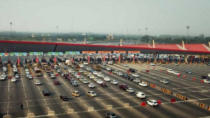 Vehicle passing through a toll plaza with FASTag.