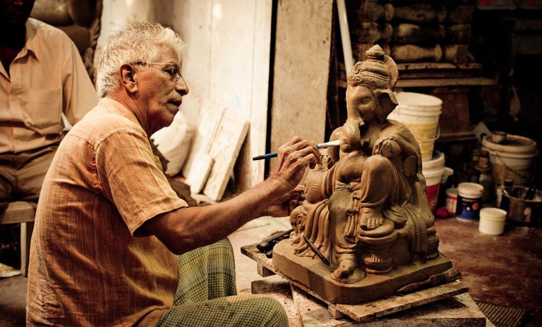 Eco-friendly Ganesh idol immersion in artificial ponds promoting environmental sustainability.