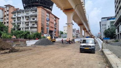 An aerial view of the Kamptee Road Double-Decker Flyover in Nagpur, showing the complexity of traffic near LIC Square.