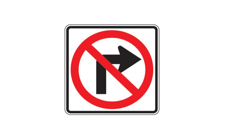 Morris College: Traffic sign at Ajni Square showing no right turn during peak hours, with vehicles moving smoothly under new rules.