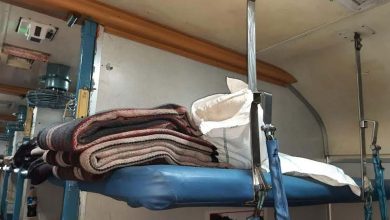 RAC passengers receiving bed rolls in AC coach