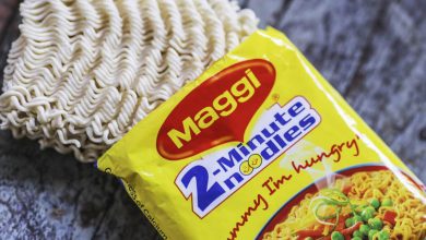 A steaming bowl of Maggi noodles with trade policy documents in the background, symbolizing the intersection of food and global economics.