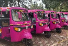 Nagpur: A vibrant pink e-rickshaw driven by a confident woman, symbolizing empowerment and sustainability.