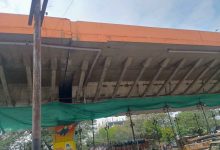 Nagpur: Damaged Butibori flyover section under inspection with visible cracks and exposed iron bars.