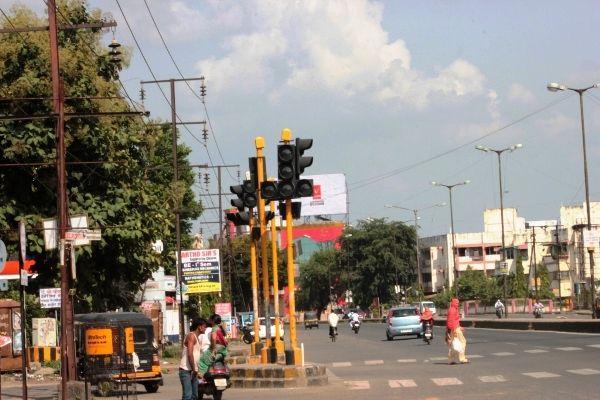 Blinking traffic signal light in Nagpur during off-peak hours.