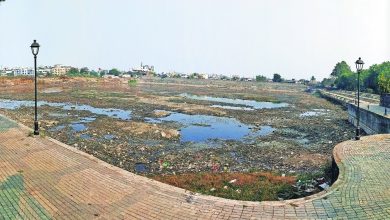 Dry Sakkardara Lake during rejuvenation work showcasing desilting efforts.