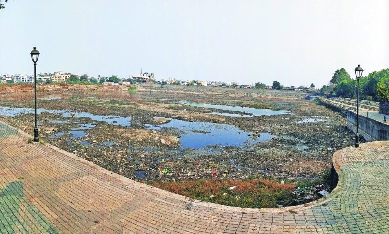 Dry Sakkardara Lake during rejuvenation work showcasing desilting efforts.