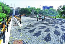 A newly constructed bridge in Nagpur, ready for public use, with clear road signs and smooth traffic flow.