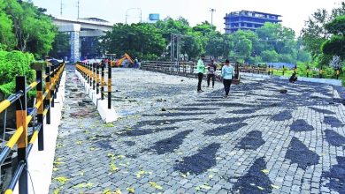 A newly constructed bridge in Nagpur, ready for public use, with clear road signs and smooth traffic flow.