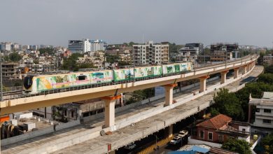 Nagpur Metro train arriving at the Airport Metro Station, symbolizing enhanced connectivity.