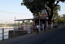 A polluted Sonegaon Lake (Nagpur) with visible sewage contamination affecting aquatic life.