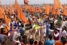 A vibrant procession celebrating Shiv Jayanti in Nagpur, featuring traditional performances and enthusiastic participants.