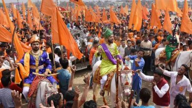 A vibrant procession celebrating Shiv Jayanti in Nagpur, featuring traditional performances and enthusiastic participants.