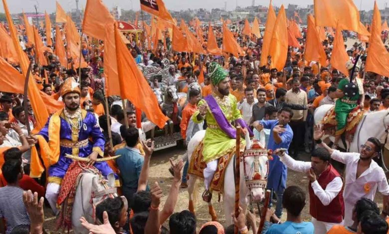 A vibrant procession celebrating Shiv Jayanti in Nagpur, featuring traditional performances and enthusiastic participants.