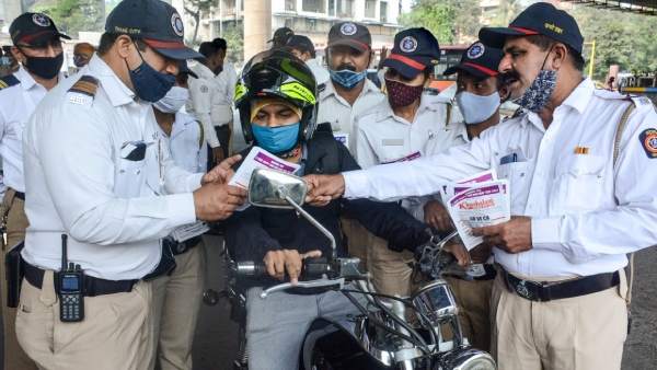 Person checking traffic challan details online to verify authenticity.