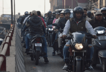 Nagpur traffic police enforcing road safety rules with penalties for wrong-side driving and signal violations.