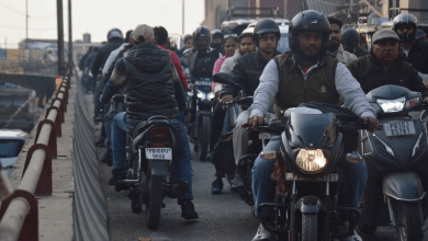 Nagpur traffic police enforcing road safety rules with penalties for wrong-side driving and signal violations.