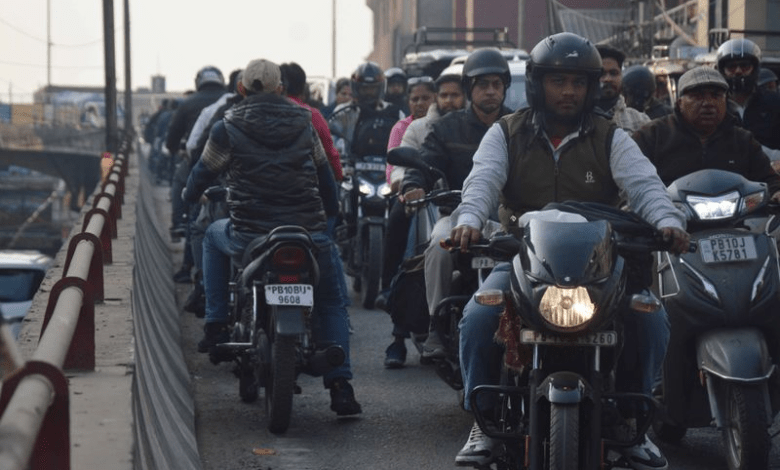 Nagpur traffic police enforcing road safety rules with penalties for wrong-side driving and signal violations.