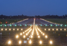 Aerial view of Dr. Babasaheb Ambedkar International Airport's runway undergoing recarpeting work.