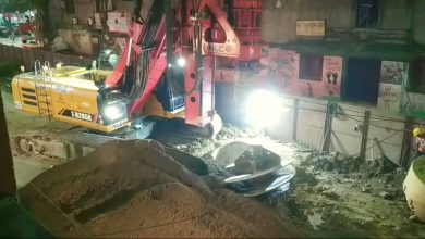 Nagpur flyover construction site showing traffic congestion and flyover pillars under construction